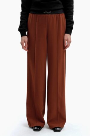 Bikses ar elastīgu jostu un logo izšuvumiem