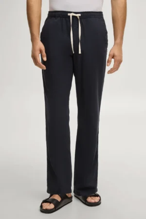 Tumši zilas bikses ar papildus kabatu