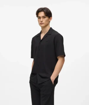 Krekls ar zīmola monogrammas izšuvumu